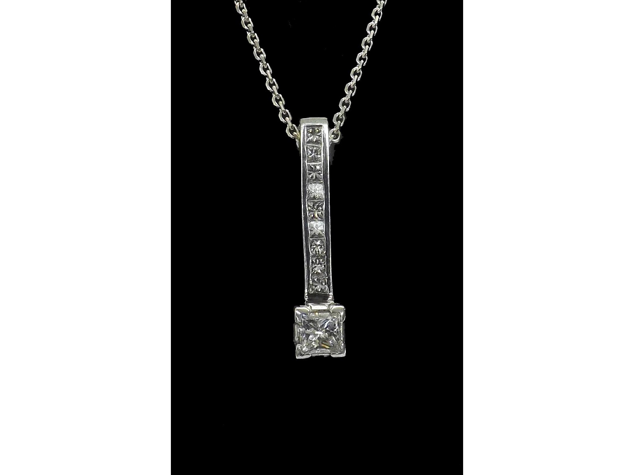 Appraisal: - -a Princess-cut diamond set drop pendant on an ct