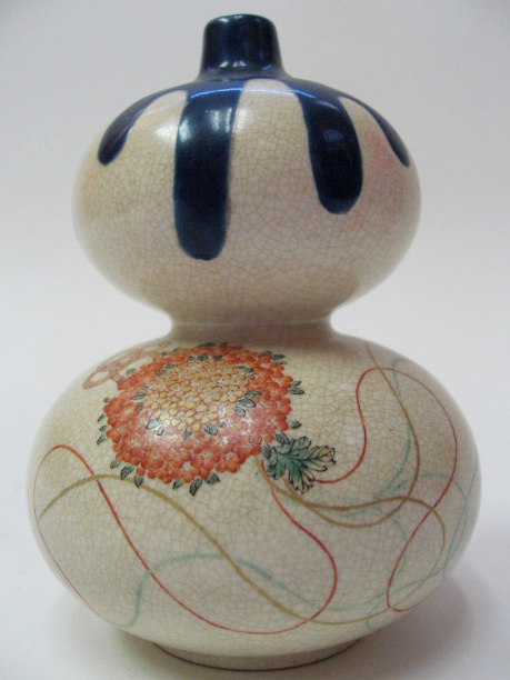 Appraisal: A Miniature Japanese Double Gourd Vase with a dark blue