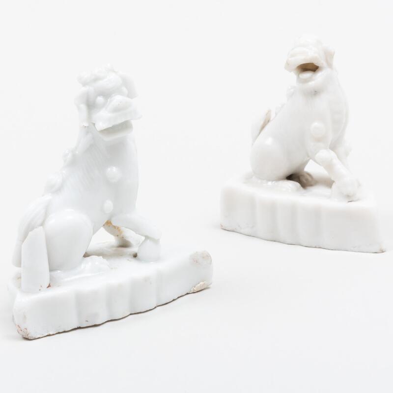 Appraisal: Two Miniature Chinese Porcelain Buddhistic Lions Unmarked The larger in