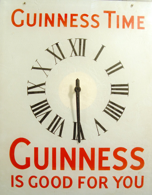 Appraisal: Rectangular glass Guinness advertising clock with printed decoration and electric