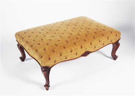 Appraisal: A Victorian mahogany style ottoman of rectangular form serpentine apron