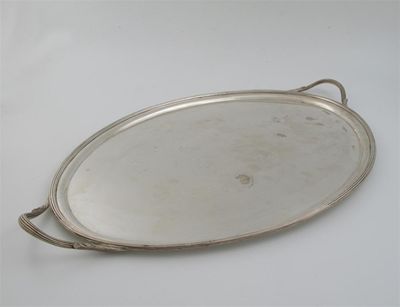 Appraisal: A modern two-handled oval tray with a reeded border by