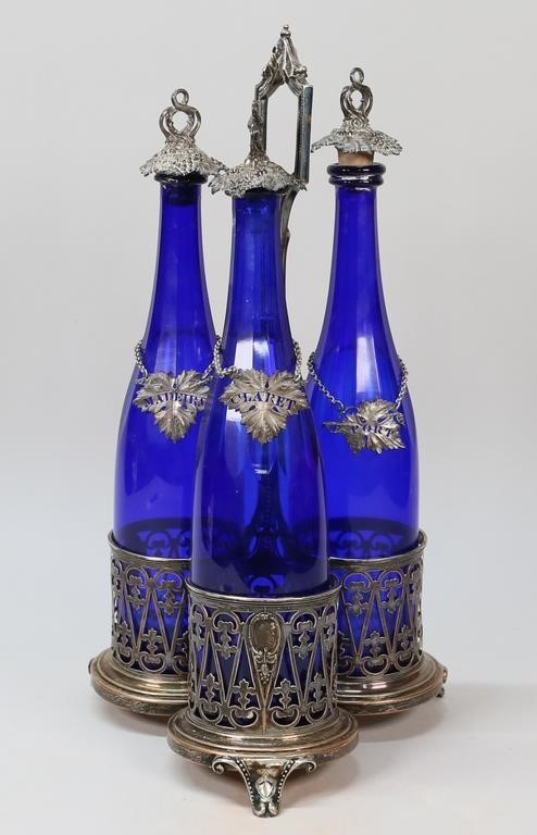 Appraisal: cobalt wine decanters with silverplate stoppers and labels in a