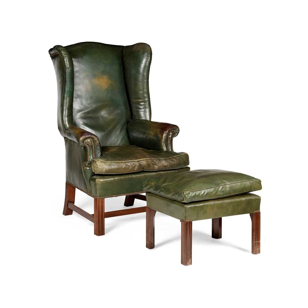 Appraisal: GEORGIAN STYLE MAHOGANY GREEN LEATHER UPHOLSTERED WING ARMCHAIR AND FOOTSTOOL