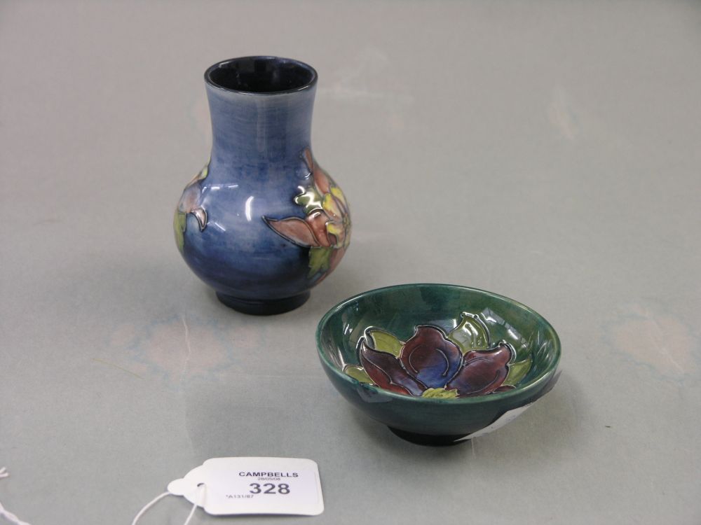 Appraisal: A Moorcroft vase Clematis against a two-tone blue ground Potters