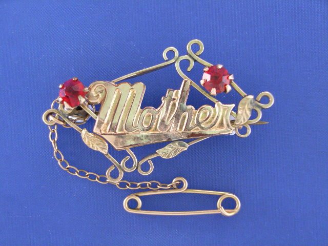 Appraisal: A vintage ct gold red stone 'Mother' bar brooch length