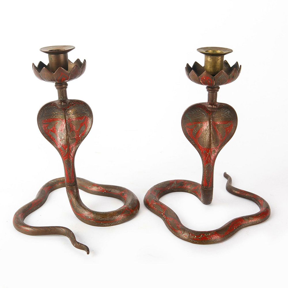 Appraisal: PAIR OF BRONZE COBRA CANDLE HOLDERS INDIA Floral shaped cup