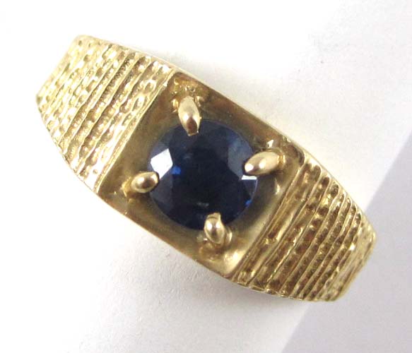 Appraisal: SAPPHIRE AND FOURTEEN KARAT GOLD SOLITAIRE RING featuring a round-cut