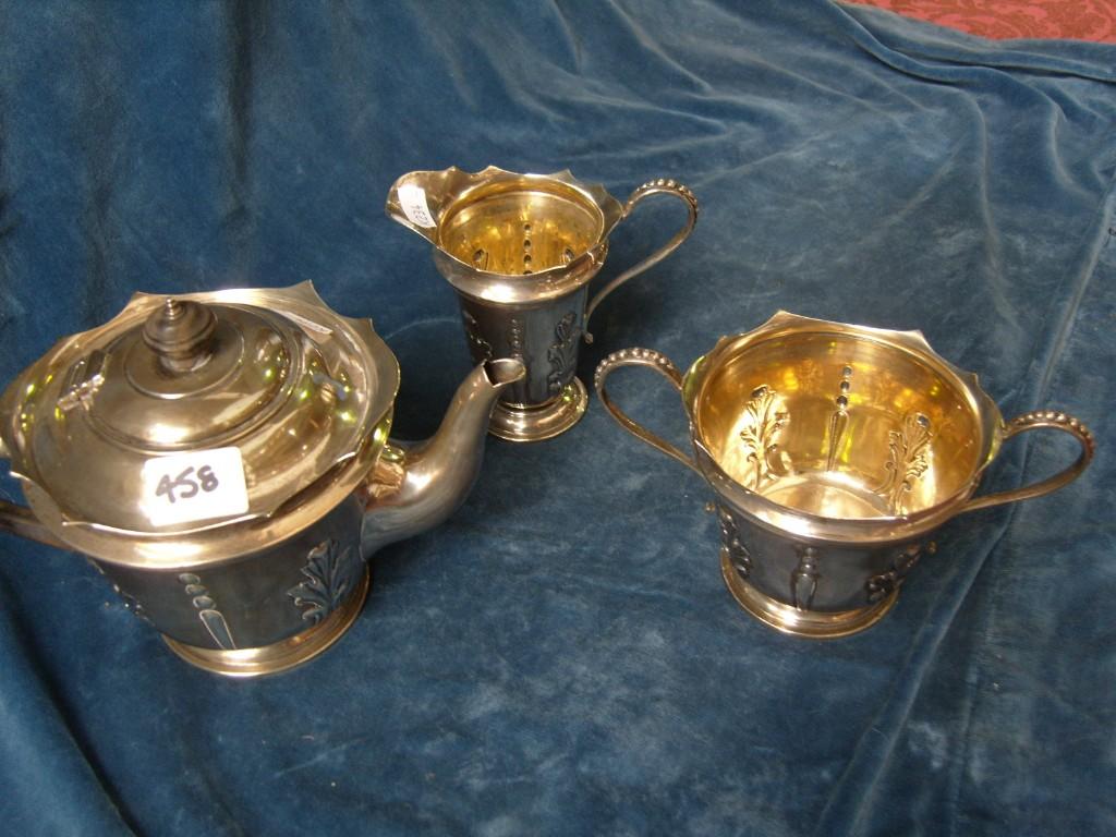 Appraisal: A silver -piece teaset of baluster form with loop handles