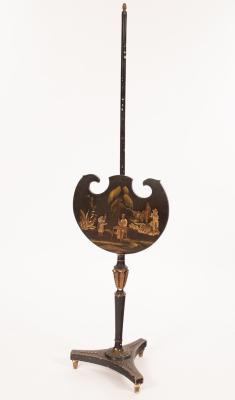 Appraisal: A th Century black lacquer pole screen with chinoiserie scene