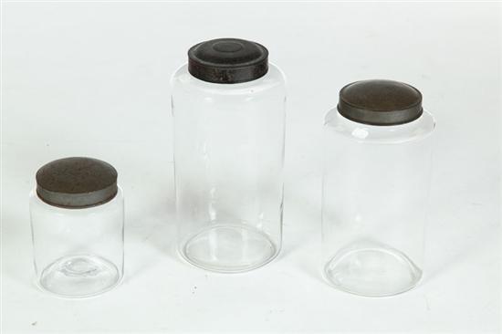 Appraisal: THREE BLOWN GLASS CANISTERS American th century With tin lids