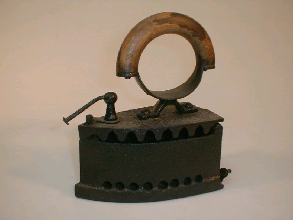 Appraisal: A thC cast iron slug iron with a half-hoop turned