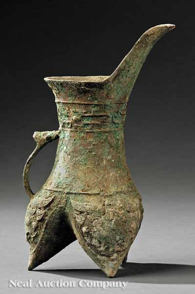 Appraisal: A Chinese Bronze Ritual Tripod Wine Vessel Jue the spreading