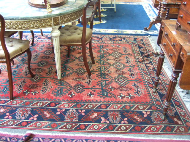 Appraisal: A Turkish rug the madder field with a trellis of