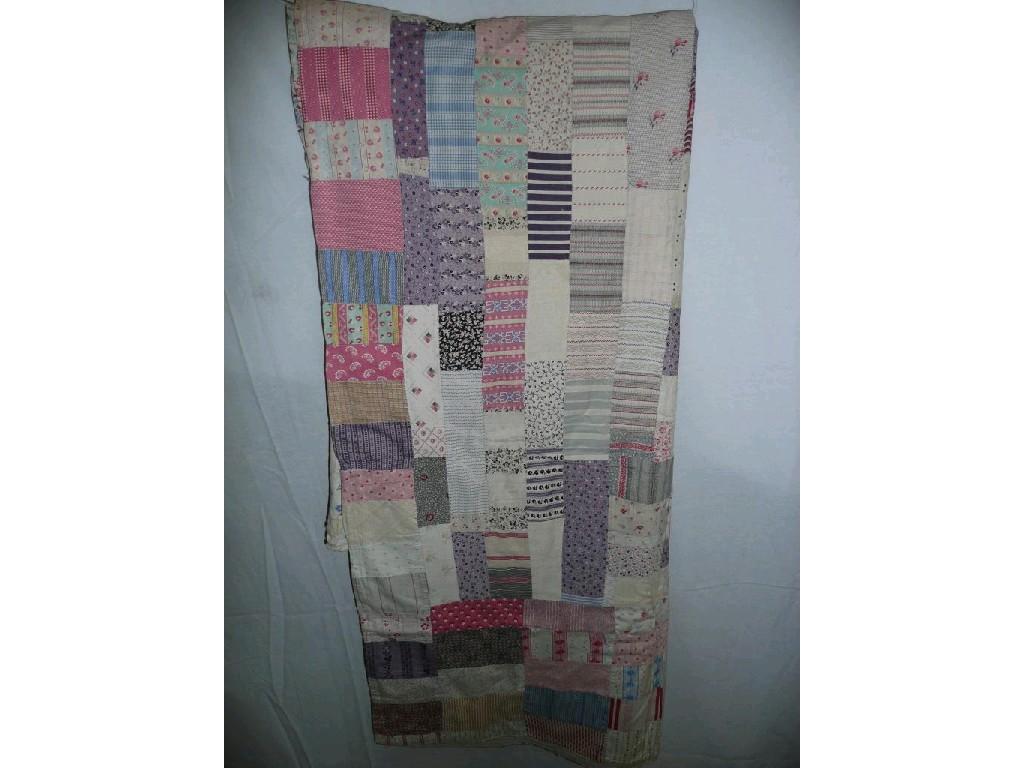 Appraisal: A vintage patchwork quilt with cotton patches in various colours