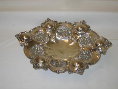 Appraisal: A LOW PEDESTAL LOBED OVAL BOWL with pierced and engraved