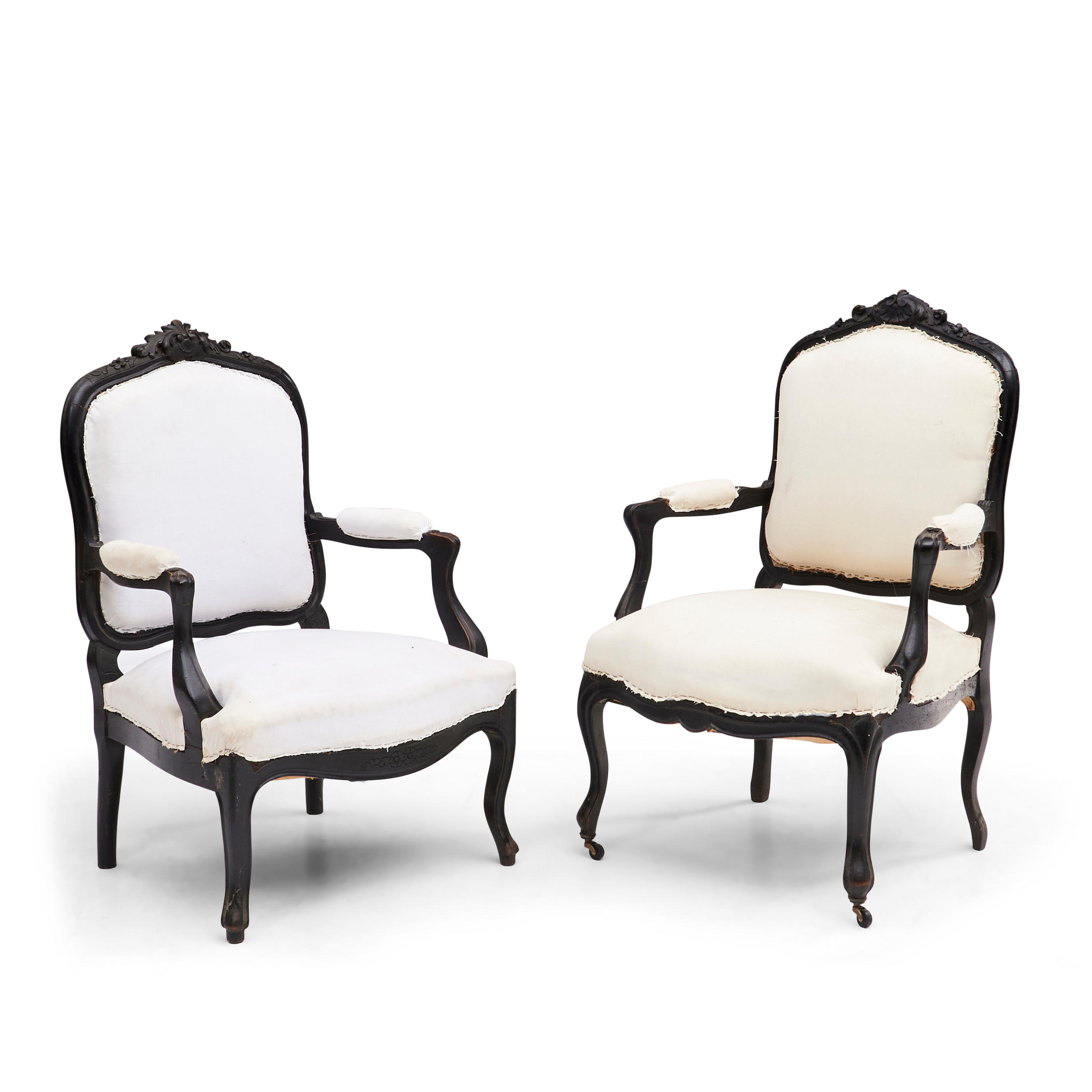 Appraisal: PAIR OF NAPOLEON III EBONIZED FAUTEUILS with molded crests and