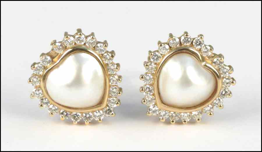 Appraisal: PAIR OF DIAMOND MABE PEARL AND KARAT GOL CLIP POST