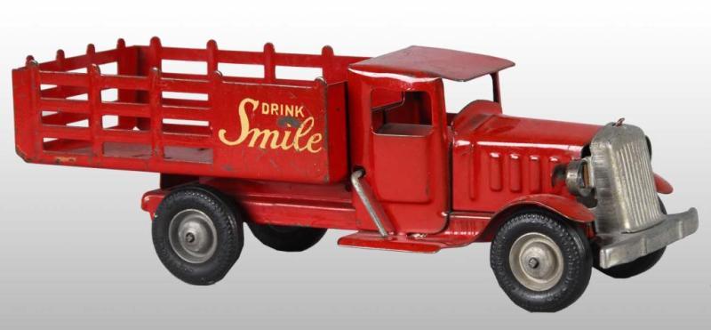 Appraisal: Pressed Steel Metalcraft Drink Smile Truck Toy Description American Drink