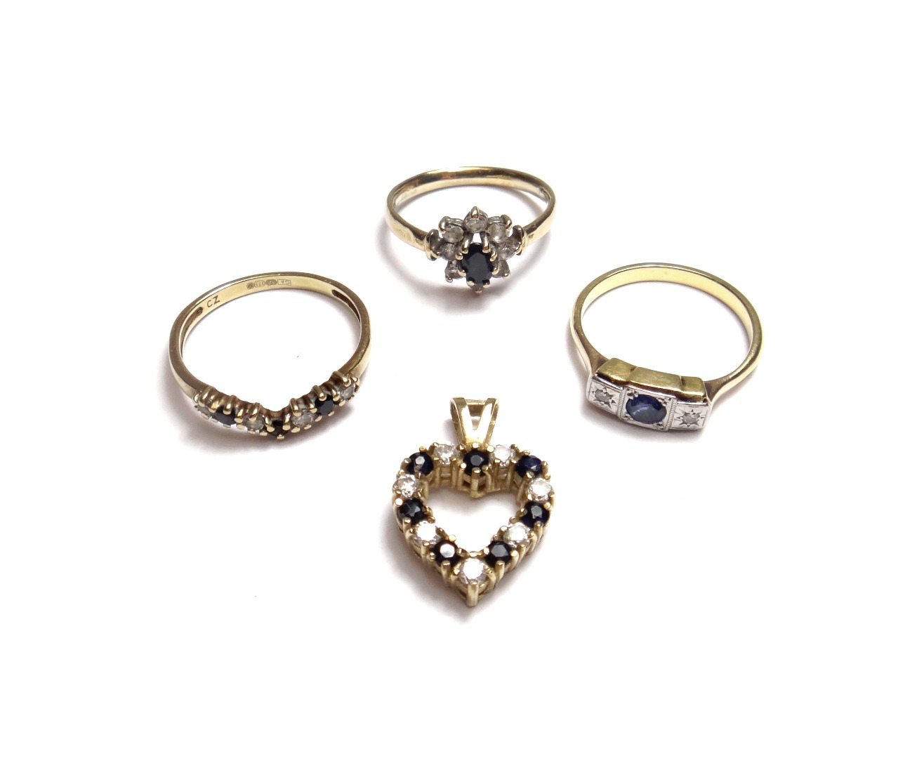 Appraisal: A gold sapphire and diamond set three stone ring a