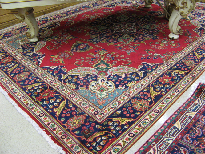 Appraisal: PERSIAN TABRIZ CARPET floral and central floral medallion design on