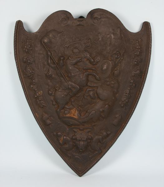 Appraisal: th Century cast iron shield depicting warriors on horses h