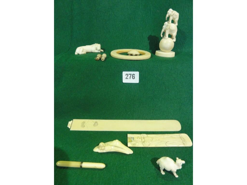 Appraisal: Small ivory pieces elephants turtle lion letter knife etc