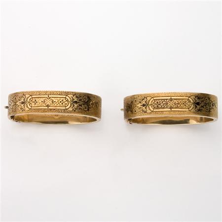 Appraisal: Pair of Antique Gold and Black Enamel Bangle Bracelets Estimate