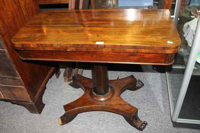 Appraisal: A VICTORIAN ROSEWOOD FOLD OVER CARD TABLE with 'D' shaped