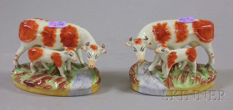 Appraisal: Pair of Staffordshire Hand-painted Cow and Calf Figural Groups th