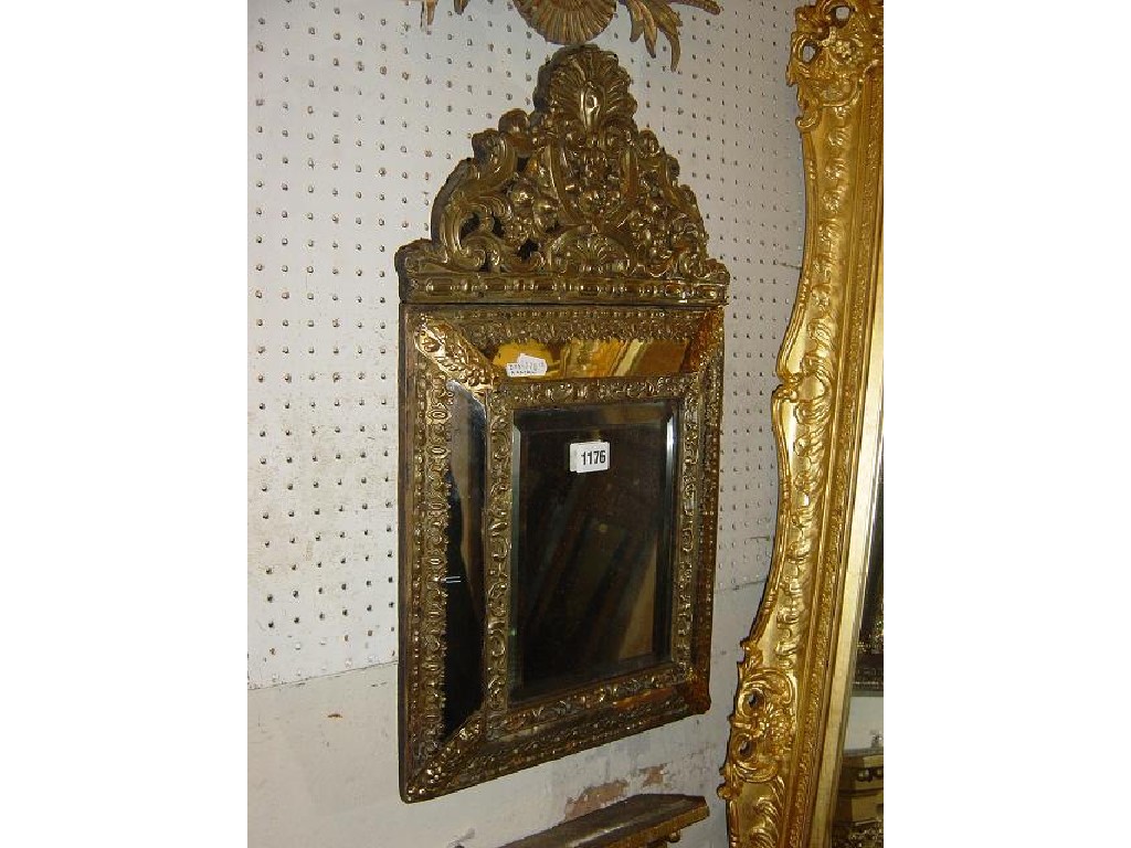 Appraisal: A small th century continental embossed brass framed wall mirror