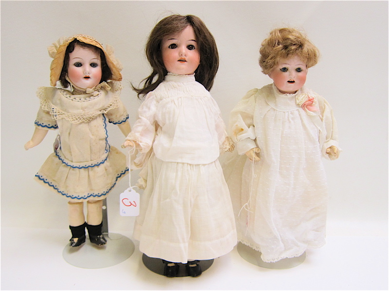 Appraisal: THREE GERMAN BISQUE SOCKET HEAD DOLLS Max Oscar Arnald with