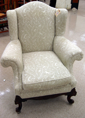 Appraisal: CHIPPENDALE STYLE WINGBACK ARMCHAIR American th century with two-tone leaf