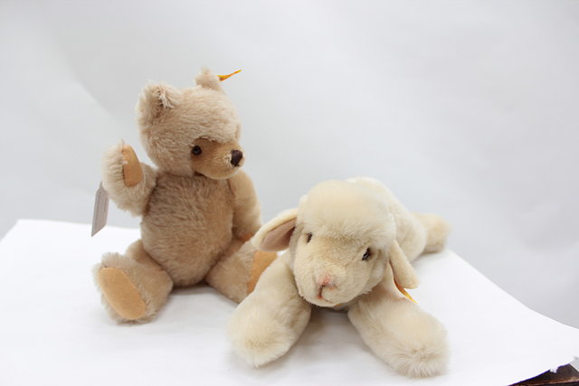 Appraisal: A SMALL STEIFF CHAMPAGNE COLOURED JOINTED TEDDY BEAR together with