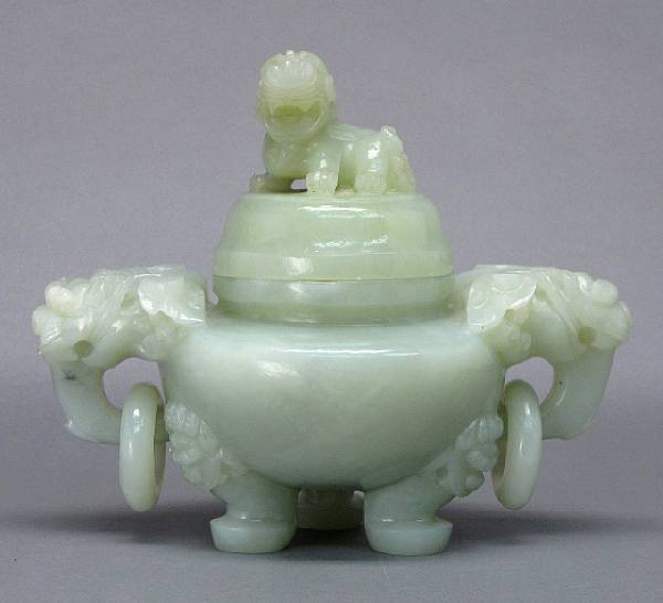 Appraisal: A serpentine tripod censer Flanked with two dragon head handles