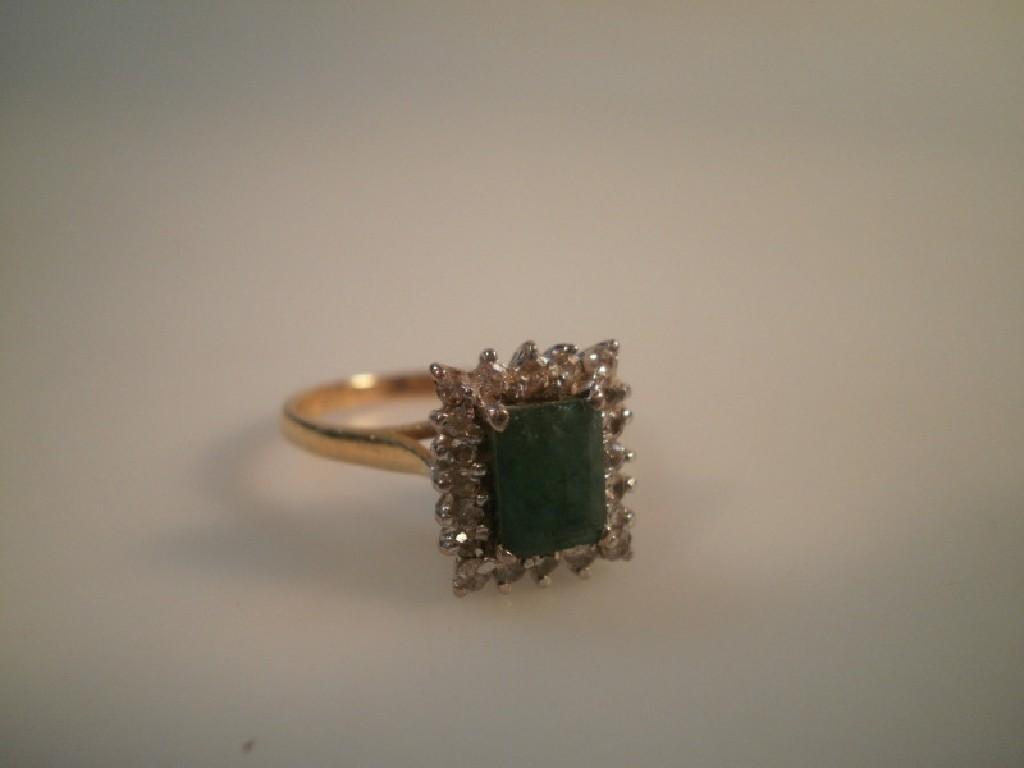 Appraisal: An emerald and diamond cluster ring the emerald of mm