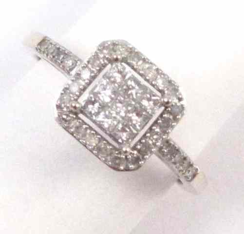 Appraisal: DIAMOND AND FOURTEEN KARAT WHITE GOLD RING set with nine