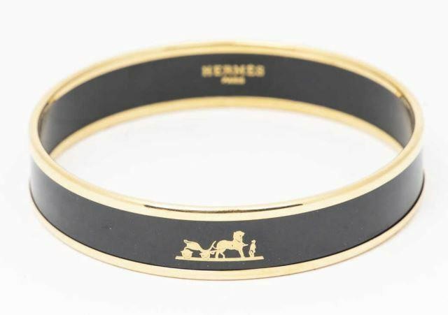 Appraisal: Hermes Caleche narrow bangle bracelet K yellow gold-plated brass with