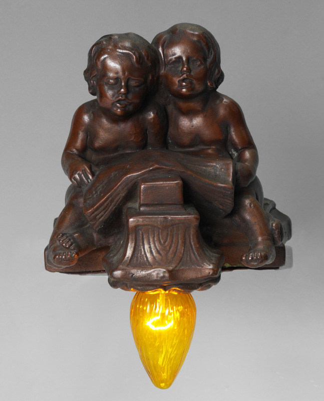 Appraisal: COPPER CLAD FIGURAL CHILDREN PIANO LAMP Figures of children looking