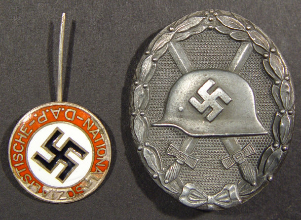 Appraisal: German Nazi oval brooch together with an enamelled swastika stick