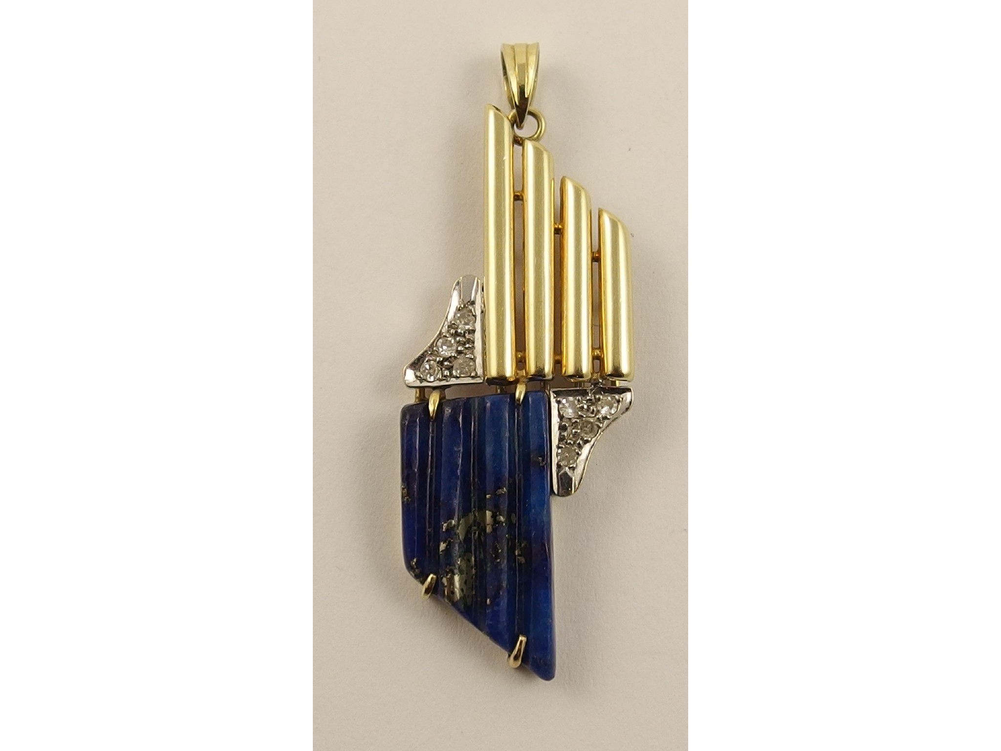 Appraisal: A ct lapis lazuli and diamond pendant