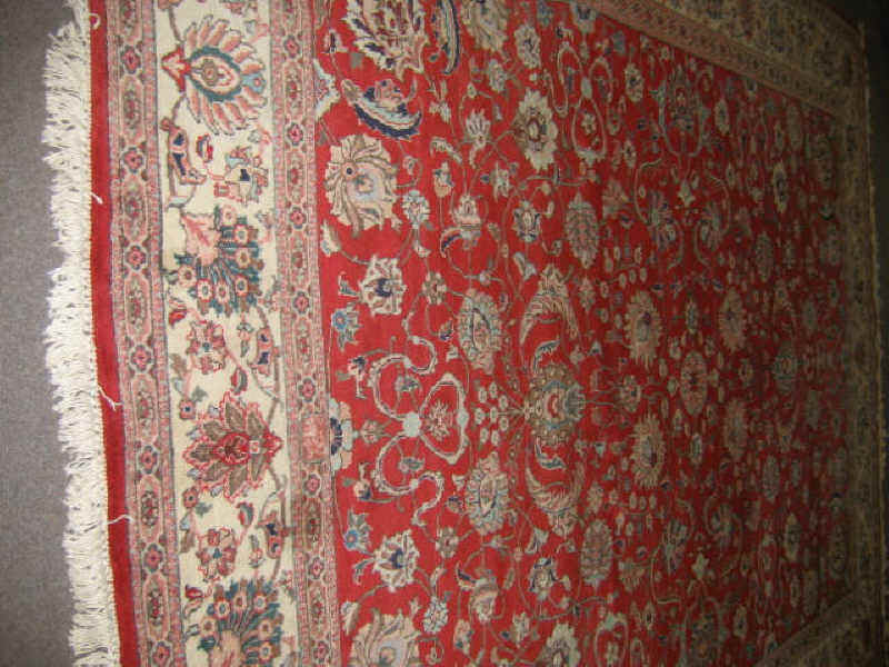 Appraisal: TABRIZ ROOM RUG The rich red field shows an allover