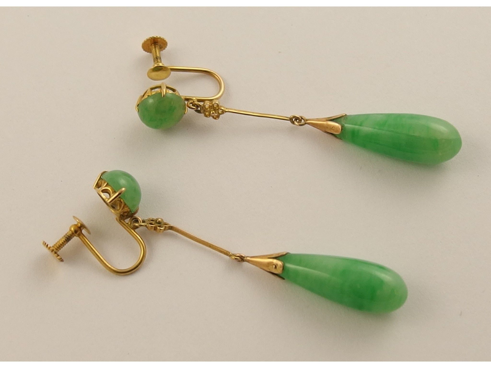 Appraisal: A pair of Chinese green hardstone drop earringswith delicate yellow