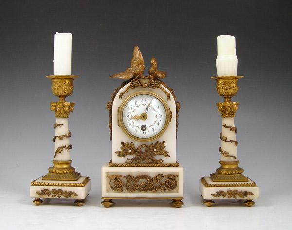 Appraisal: DIMINUTIVE FRENCH MARBLE CLOCK GARNITURE SET White marble and ormolu