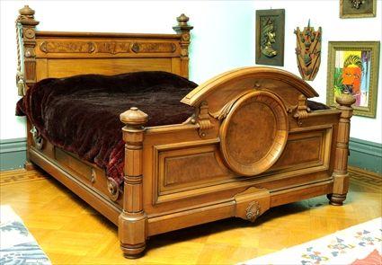 Appraisal: AMERICAN RENAISSANCE REVIVAL WALNUT AND FIGURED WALNUT BEDSTEAD The headboard