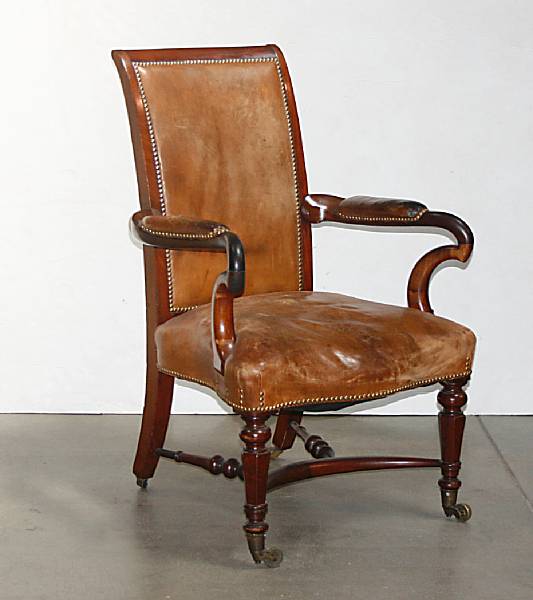 Appraisal: A Victorian walnut and leather armchair mid th century