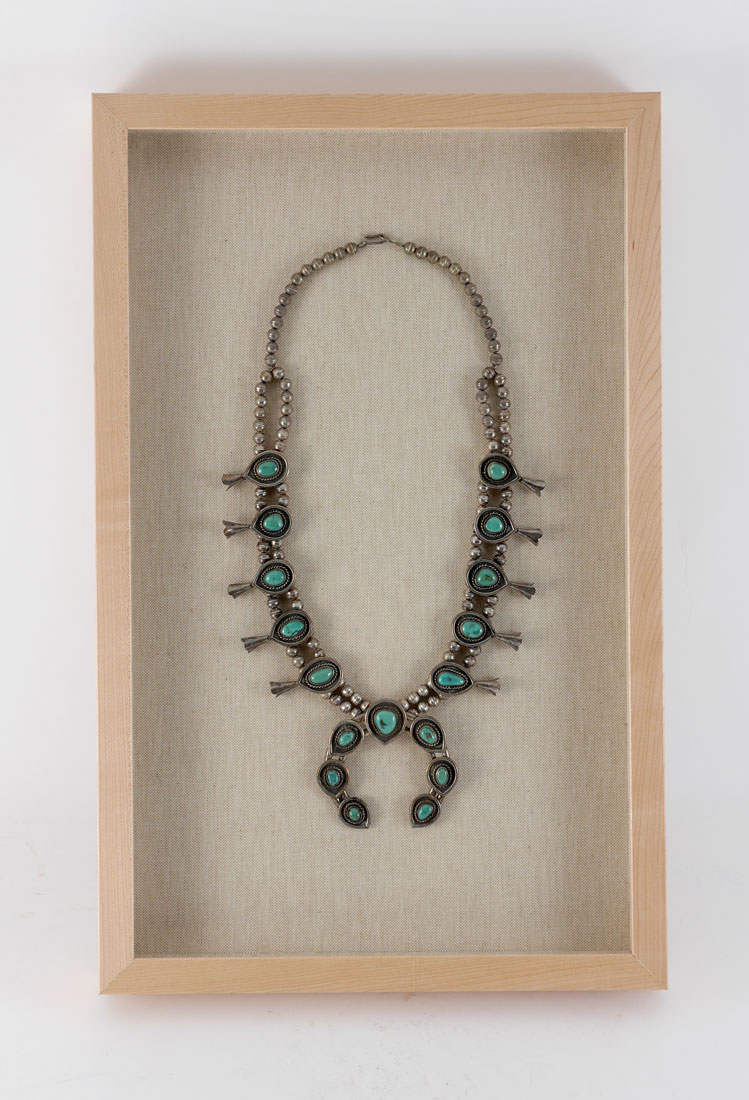 Appraisal: FRAMED TURQUOISE SQUASH BLOSSOM NECKLACE The greenish turquoise stones are