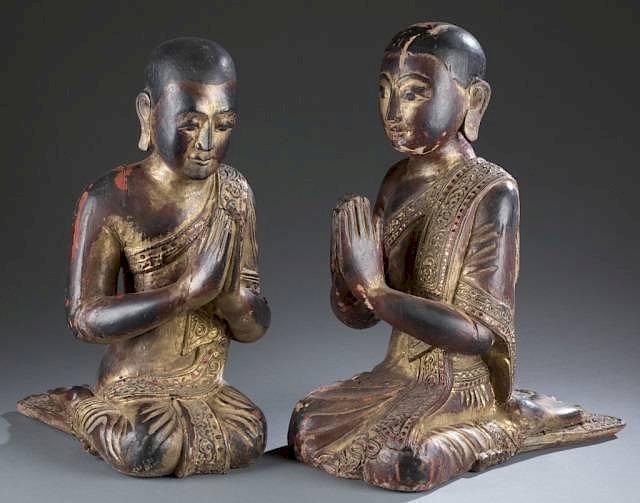 Appraisal: Pair of carved wood Thai monk figures A pair of