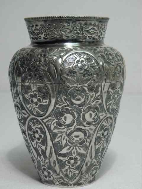 Appraisal: A Middle eastern floral embossed silver vase stamped on base