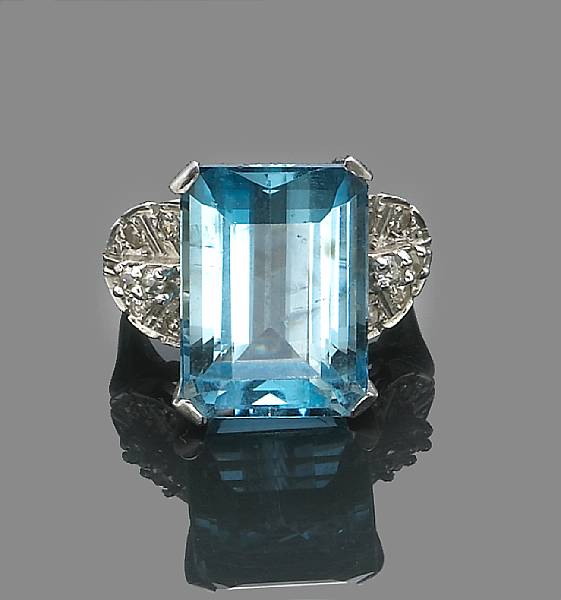 Appraisal: An aquamarine and diamond ring centering a rectangular-cut aquamarine weighing